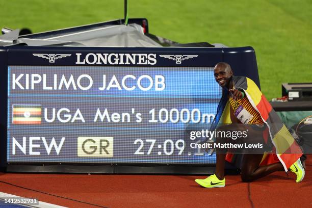 Jacob Kiplimo of Team Uganda celebrates a new Games Record next time the time board after winning the Gold medal in the Men's 10,000m Final on day...