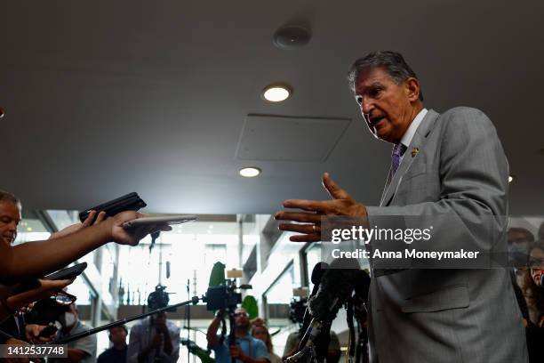 Sen. Joe Manchin speaks to reporters outside of his office in the Hart Senate Office Building on August 02, 2022 in Washington, DC. Negotiations in...