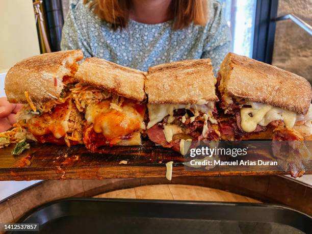 close-up of an enormous pastrami sandwich - large cucumber stockfoto's en -beelden
