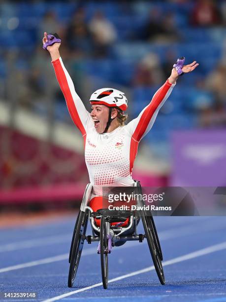 Hannah Cockroft of Team England celebrates winning the Gold medal in the Women's T33/34 100m Final on day five of the Birmingham 2022 Commonwealth...