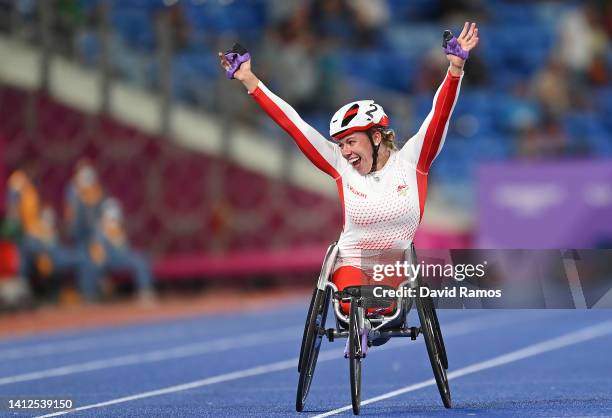 Hannah Cockroft of Team England celebrates winning the Gold medal in the Women's T33/34 100m Final on day five of the Birmingham 2022 Commonwealth...