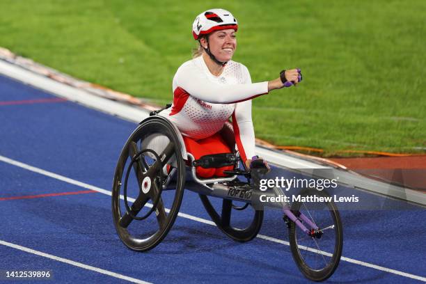 Hannah Cockroft of Team England celebrates winning the Gold medal in the Women's T33/34 100m Final on day five of the Birmingham 2022 Commonwealth...