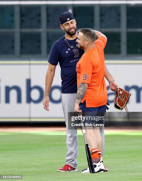 Houston Astros newly acquired catcher Christian Vazquez meets with his former Boston Red Sox teammates before a game at Minute Maid Park on August...