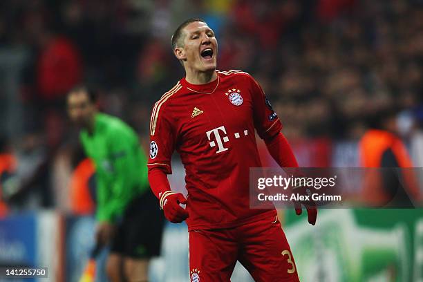 Bastian Schweinsteiger of Muenchen reacts during the UEFA Champions League Round of 16 second leg match between FC Bayern Muenchen and FC Basel at...