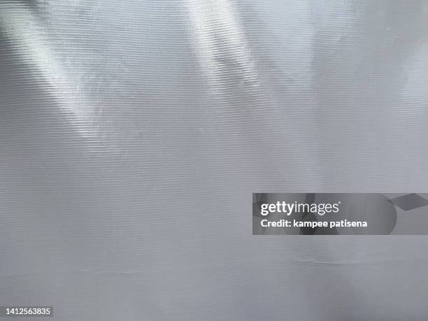 grey textured tarpaulin canvas textile - nylon stock-fotos und bilder