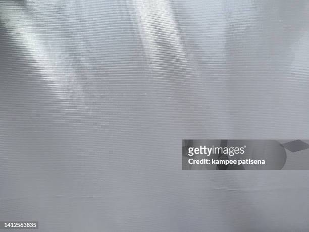 grey textured tarpaulin canvas textile - tarpaulin stock pictures, royalty-free photos & images