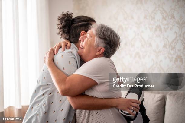 mother and transgender son hugging - 3d mom son stock pictures, royalty-free photos & images