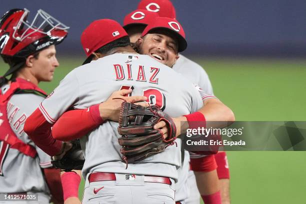 Kyle Farmer of the Cincinnati Reds hugs Alexis Diaz after defeating the Miami Marlins at loanDepot park on August 02, 2022 in Miami, Florida.