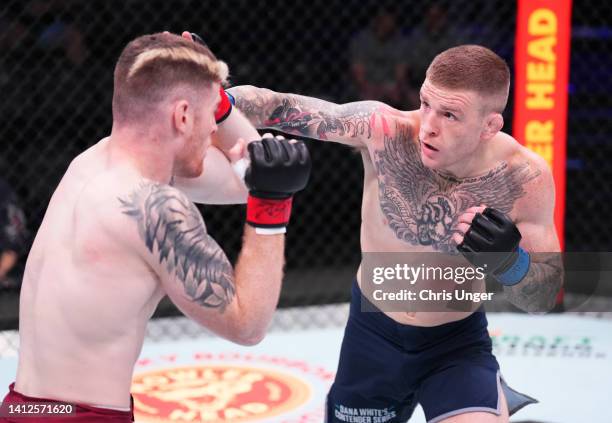 Chris Duncan of Scotland punches Charlie Campbell in a lightweight fight during Dana White's Contender Series season six, week two at UFC APEX on...