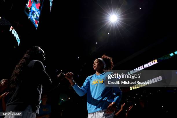 Candace Parker of the Chicago Sky high fives Kahleah Copper as she is introduced prior to the game against the Dallas Wings during the first half at...