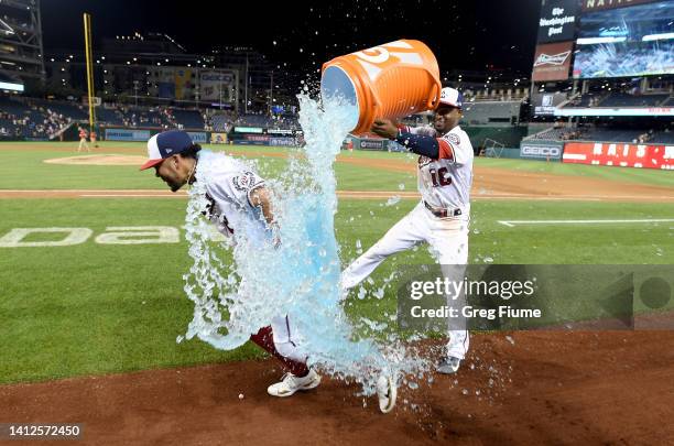 Luis Garcia of the Washington Nationals is doused with Gatorade by Victor Robles after a 5-1 victory against the New York Mets at Nationals Park on...