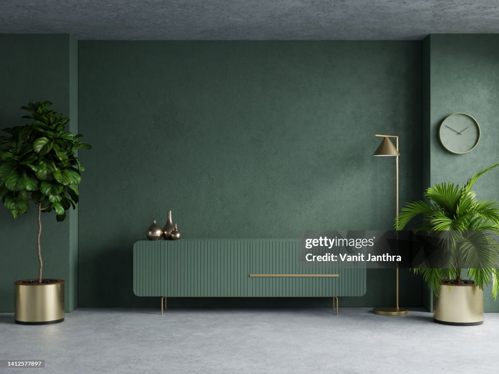 Living room with cabinet for tv on dark green color wall background.