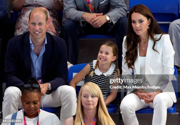 Prince William, Duke of Cambridge, Princess Charlotte of Cambridge and Catherine, Duchess of Cambridge watch the swimming competition at the Sandwell...