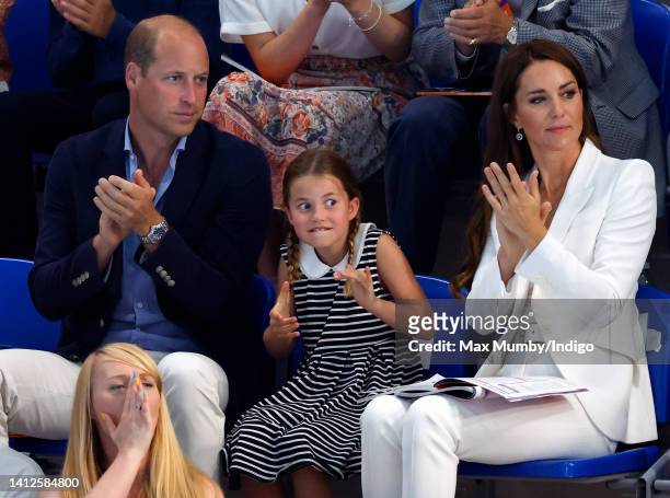 Prince William, Duke of Cambridge, Princess Charlotte of Cambridge and Catherine, Duchess of Cambridge watch the swimming competition at the Sandwell...