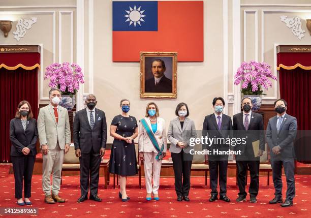 Speaker of the U.S. House Of Representatives Nancy Pelosi , center left, poses for photographs after receiving the Order of Propitious Clouds with...