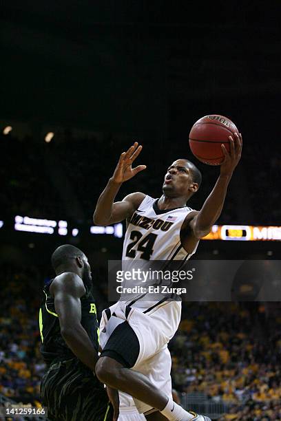 Kim English of the Missouri Tigers shoots over a Baylor Bears player during the championship game of the Big 12 Basketball Tournament March 10, 2012...
