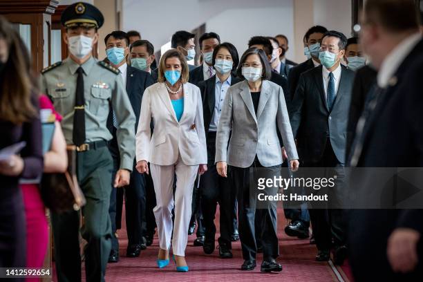 Speaker of the U.S. House Of Representatives Nancy Pelosi , center left, speaks Taiwan's President Tsai Ing-wen, center right, after arriving at the...