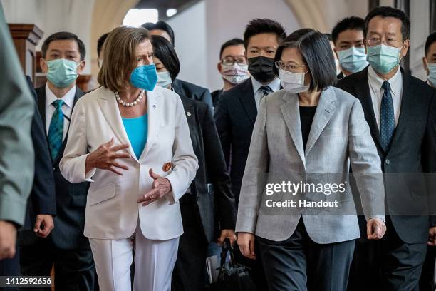 Speaker of the U.S. House Of Representatives Nancy Pelosi , center left, speaks Taiwan's President Tsai Ing-wen, center right, after arriving at the...