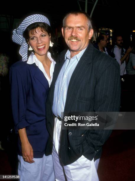 John Ratzenberger and Georgia Stiny at the Premiere of 'Crocodile Dundee II', Mann's Chinese Theatre, Hollywood.