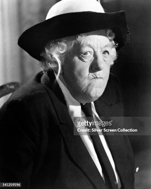 Margaret Rutherford , British actress, wearing a black hat, black coat and a white blouse with a black tie, in a publicity still issued for the film,...