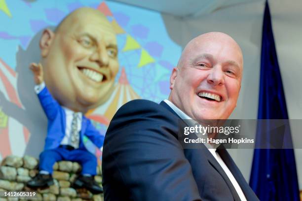 National Party Leader Christopher Luxon enjoys a laugh in front of his puppet caricature during an unveiling event at The Backbencher Pub on August...