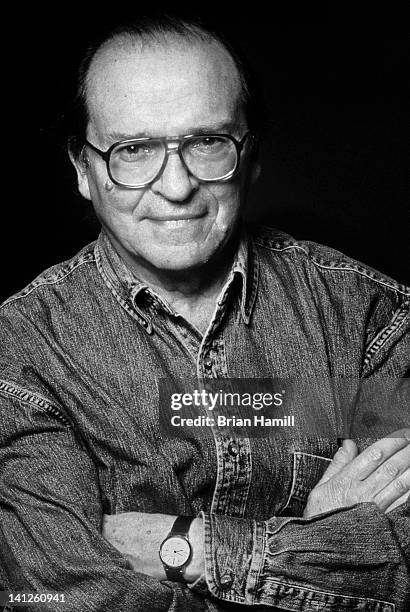 Portrait of American film director Sidney Lumet as he poses with his arms crossed in front of his chest on the set of his film, 'Gloria,' New York,...