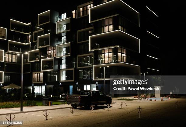 car parked in front of new apartment building - krakow park stock pictures, royalty-free photos & images