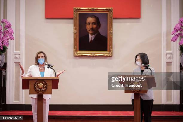 Speaker of the U.S. House Of Representatives Nancy Pelosi , left, speaks after receiving the Order of Propitious Clouds with Special Grand Cordon,...