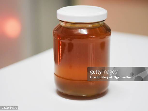 honey bottle sweet food - manuka honey stock pictures, royalty-free photos & images
