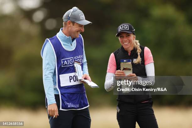 Sophia Popov of Germany laughs with their Caddie on the 1st hole during the Pro-Am prior to the AIG Women's Open at Muirfield on August 03, 2022 in...