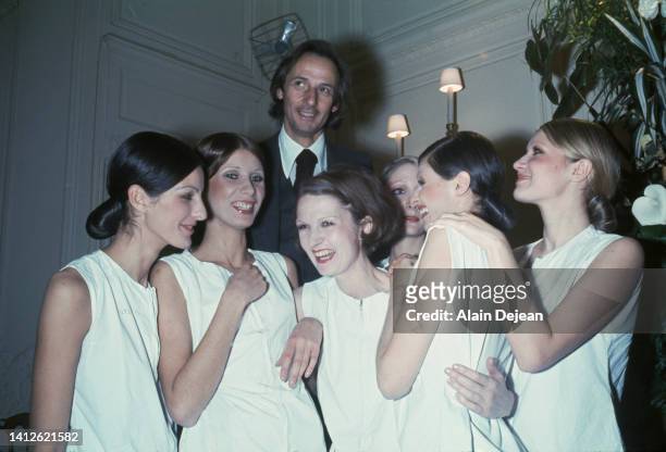 Marc Bohan, French fashion designer for the house of Dior, with models.