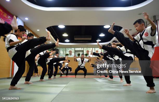 Children learn wrestling at a gym during the summer vacation on August 3, 2022 in Shijiazhuang, Hebei Province of China.