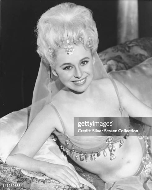 Barbara Windsor, British actress, wearing a harem costume in a publicity portrait issued for the film, 'Carry on Spying', Great Britain, 1964. The...