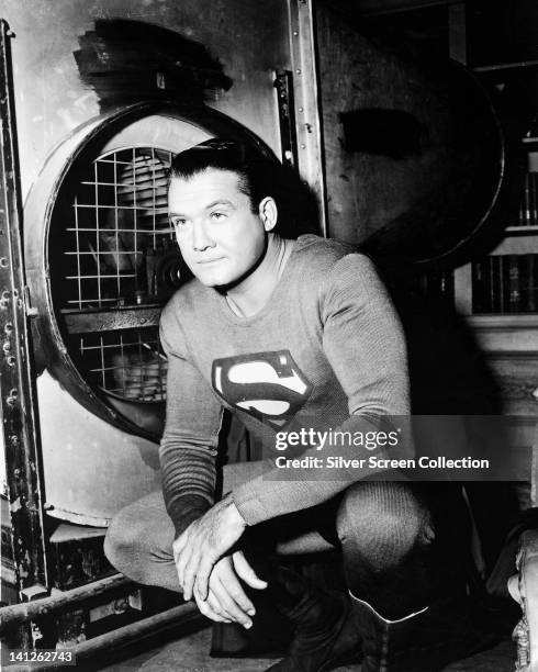 George Reeves , US actor, in costume in a publicity portrait issued for the US television series, 'Adventures of Superman', USA, circa 1955. The...