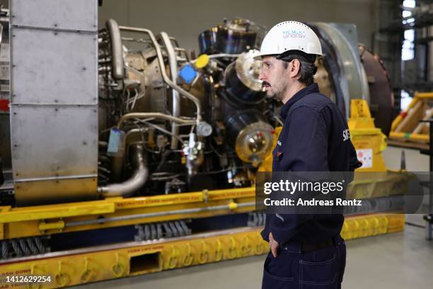 Siemens Energy technician looks at the Siemens gas turbine intended for the Nord Stream 1 gas pipeline in Russia at a Siemens Energy facility on...