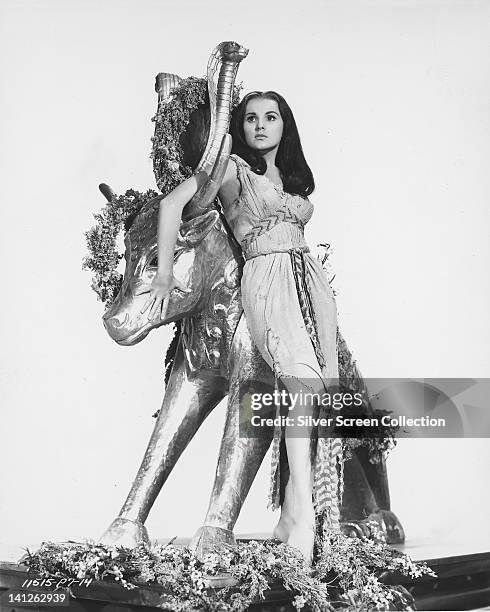 Debra Paget, US actress, in costume, posing against a statue of a bull in a publicity portrait issued for the film, 'The Ten Commandments', 1956. The...