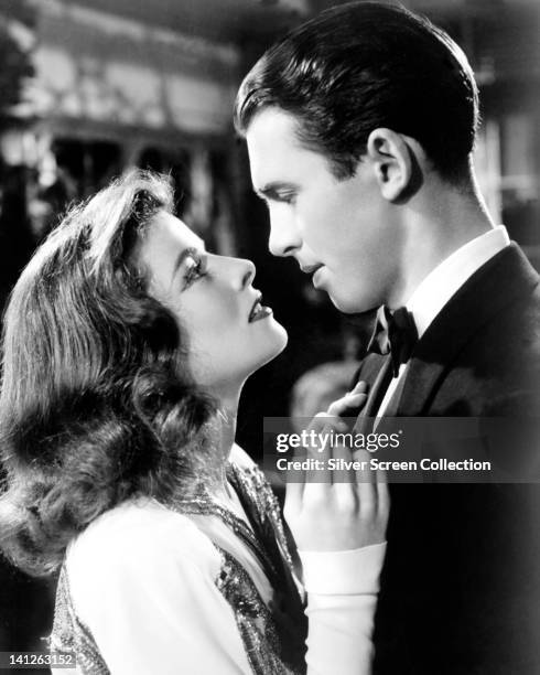Katharine Hepburn , US actress, and James Stewart , US actor, in a passionate embrace in a publicity still issued for the film, 'The Philadelphia...