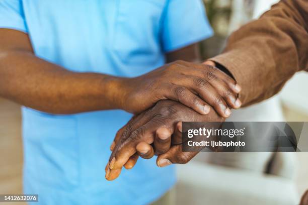 touch someone's heart with kindness - parkinsons disease stock pictures, royalty-free photos & images