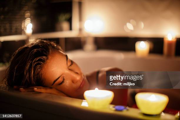 beautiful woman posing in hot bath tub - hot fitness models female stock pictures, royalty-free photos & images