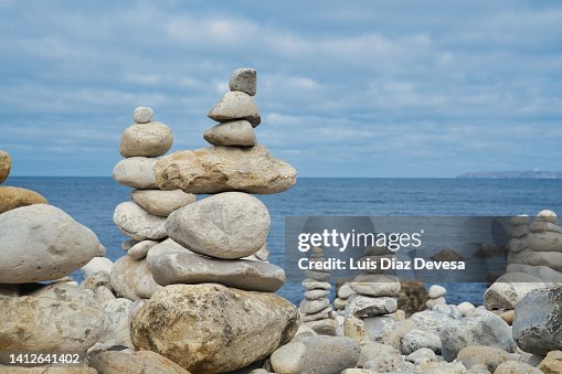 Blue Beach Rocks Stacked A Piles Of Rocks Stacked On The Beach High-Res Stock Photo - Getty Images