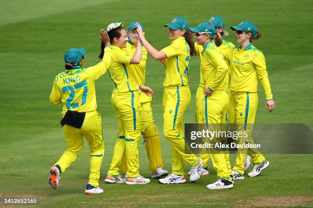 Megan Schutt of Team Australia celebrates with teammates after bowling Muneeba Ali Siddiqui of Team Pakistan during the Cricket T20 Group A match...