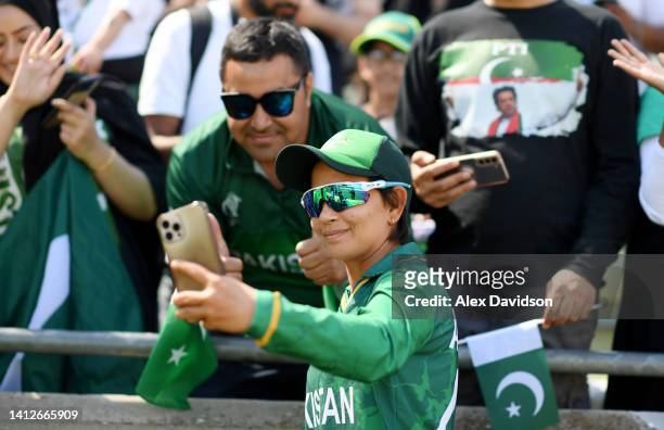 Anam Amin of Team Pakistan takes a selfie with a fan following the Cricket T20 Group A match between Team Australia and Team Pakistan on day six of...