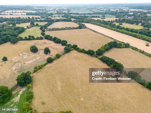 An aerial view of fields, on August 03, 2022 in Romsey, England. The south of England has experienced the driest July since records began in 1836...