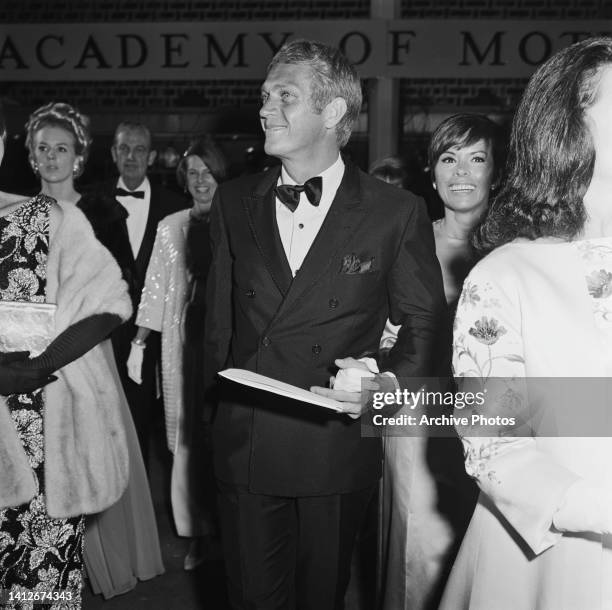 American actor Steve McQueen and his wife, Filipina-American actress and singer Neile Adams, among guests attending the 39th Academy Awards, held at...