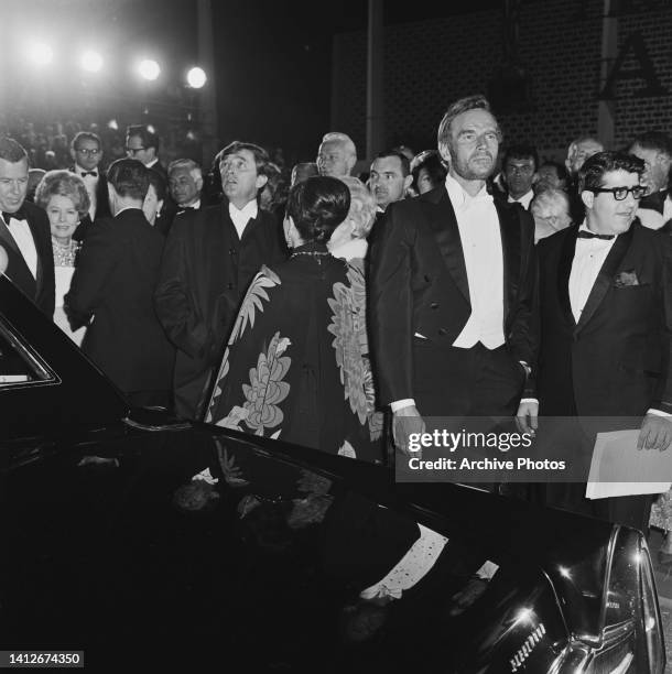 American actor Robert Mitchum and American actor Charlton Heston among guests attending the 39th Academy Awards, held at the Santa Monica Civic...