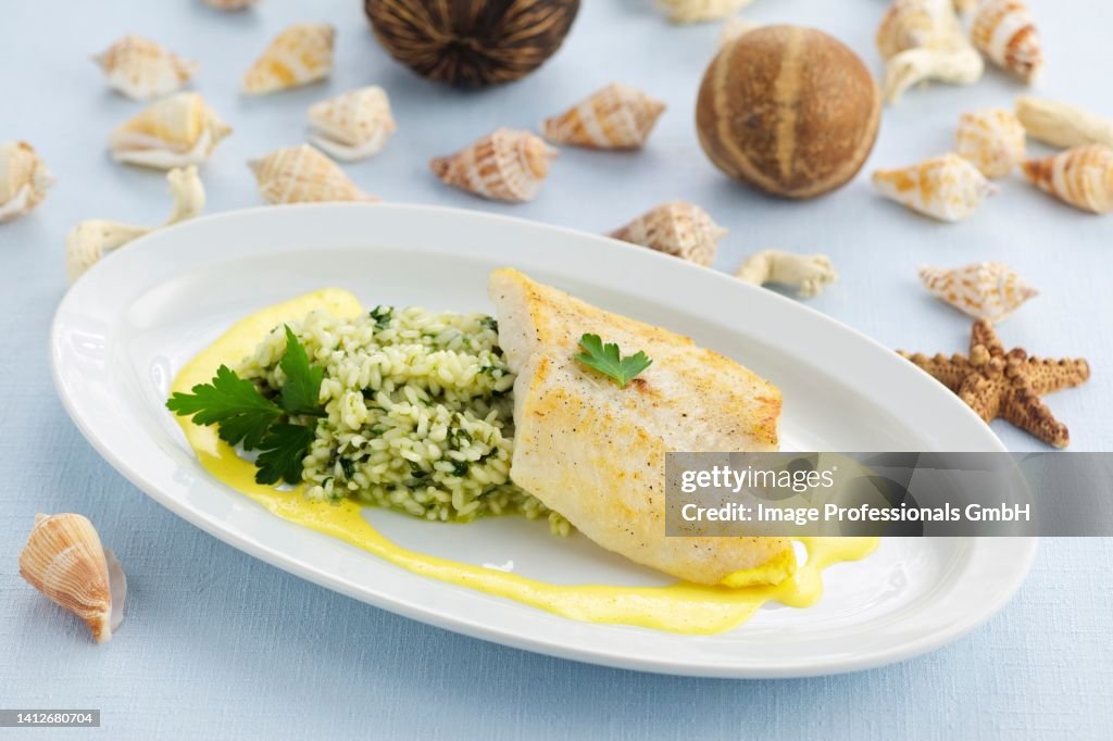 Sea bream with rocket risotto and saffron sauce