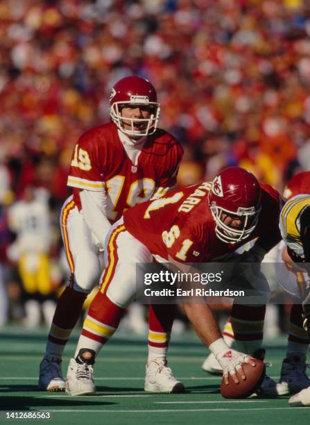 Joe Montana, Quarterback for the Kansas City Chiefs calls the play as, Center and Guard Tim Grunhard prepares to make the snap on the line of...