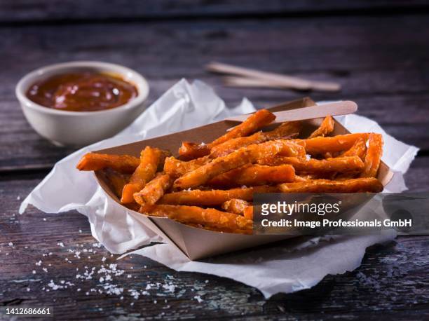 sweet potatoes fries with barbecue sauce - sweet potato fries stock pictures, royalty-free photos & images