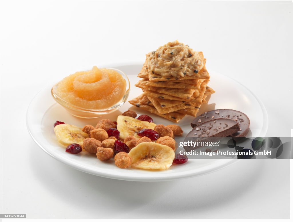 Snacks: crackers with tuna cream, applesauce, trail mix and chocolate