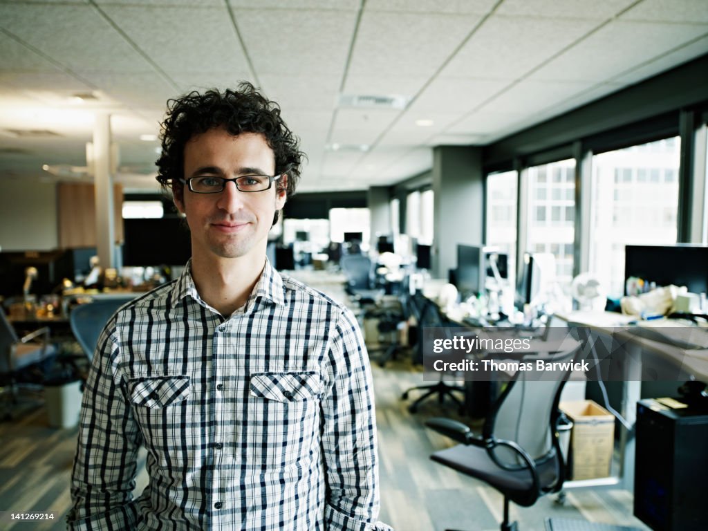 IT professional in high tech office smiling